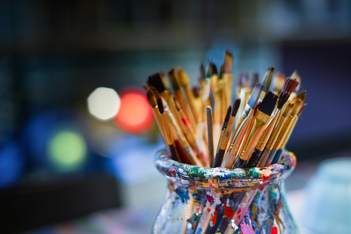 Paintbrushes in a glass jar